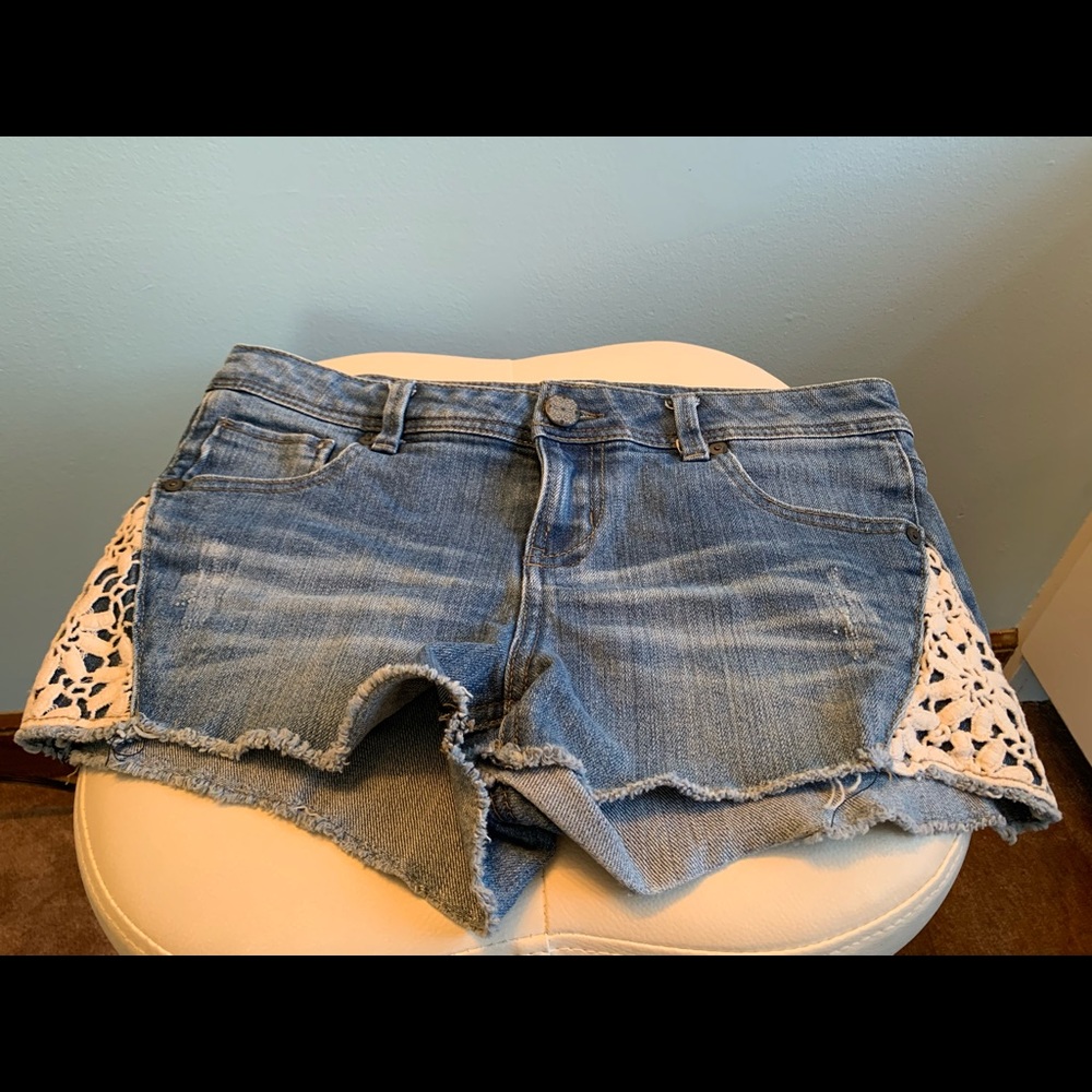 jean shorts with white lace detailing